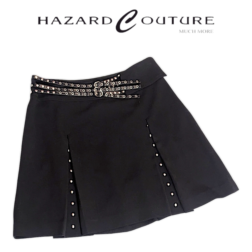 Hazard Couture - Pleated mini skirt: stud detailing with built-in strappy belt